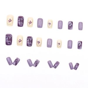 Square press-on nails set with purple floral designs and solid colors on white background