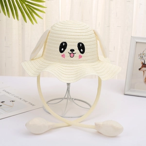 Detail of cute rabbit straw hat for kids featuring moving ears and soft beige weaving