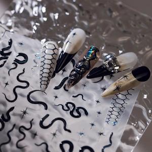 3D embossed nail art stickers featuring black snakes and laser starlight patterns