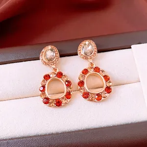 Orecchini vintage dorati con cristalli champagne e arancioni in scatola regalo