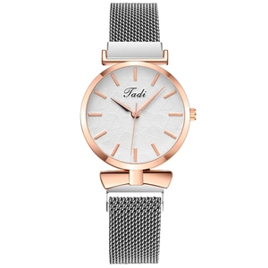 Minimalist women's watch with rose gold leaf-textured dial and grey Milanese mesh strap