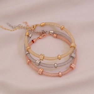 Three-piece sparkling rhinestone mesh cuff bracelets in gold, silver, and rose gold finish