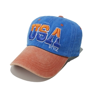 Dettaglio cappellino vintage lavato con ricamo USA 3D e visiera a contrasto in cotone