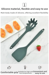 Deep green silicone spatula and pasta server set on marble background for non-stick pans
