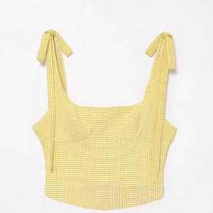 Short yellow and white gingham camisole with decorative shoulder bows and woven texture