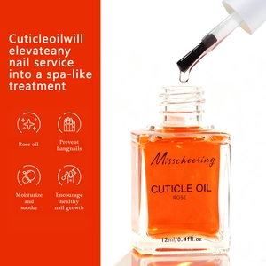 Macro shot of 12ml rose cuticle oil bottle with brush applicator for nail hydration
