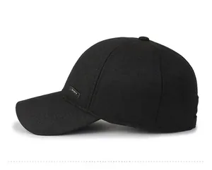 Detail view of winter baseball cap with silver Sports logo on twill fabric side