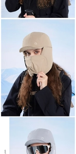 Close-up of padded winter trapper hat with earflaps and mask for outdoor protection
