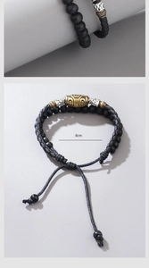 Macro detail of hand-woven cord necklace with vintage cylinder beads and adjustment mechanism