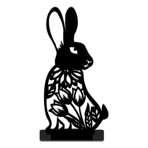 Detail of a black hollow rabbit sculpture with floral patterns on a sturdy base stand