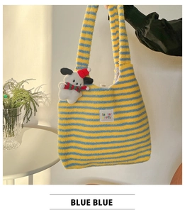 Detailed texture of blue and yellow striped plush tote bag with a cute puppy keychain