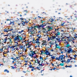Macro shot of 2-8mm irregular mixed glass gravel and colorful seashell nail art flakes