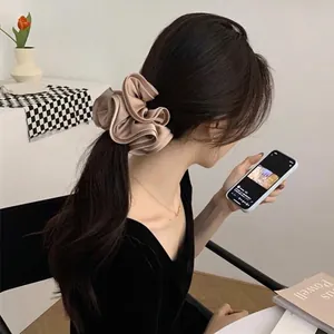 French vintage oversized champagne satin scrunchie for elegant ponytail styling