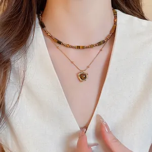 Double-layer tiger eye stone necklace with heart pendant and golden bead chain