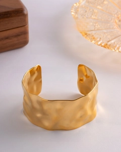 Detail of 18K gold vacuum plated stainless steel wide cuff with hammered texture