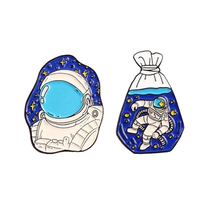 Creative astronaut enamel pin set featuring spaceman and shopping bag designs