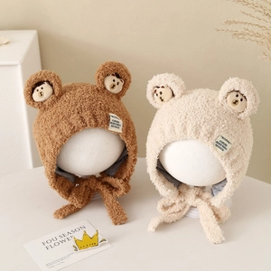 Plush winter bear ear hat for babies with chin straps in brown and beige colors