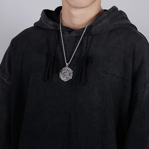 Silver hexagram pendant with twisted rope chain shown on a black hoodie model