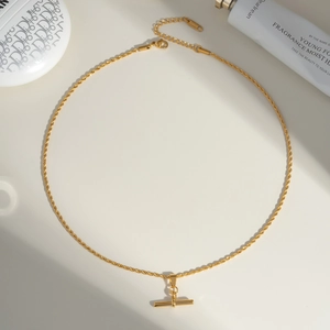 Macro shot of gold T-Bar pendant necklace with adjustable chain and S.Steel hallmark