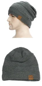 Detail view of dark gray knit beanie with F&S leather label and inner fleece lining