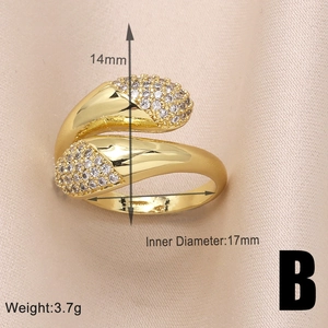 Detail view of gold geometric wing ring showing 14mm width and 17mm inner diameter