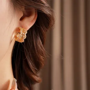 Luxurious gold C-shaped hoop earrings with micro-pave cubic zirconia for a sparkling look