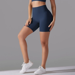 Macro detail of high-waist seamless navy yoga shorts with premium matte fabric texture