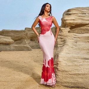 Detail of pink floral print dress showing mesh fabric texture and flowy mermaid hem