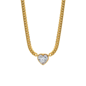 Golden Cuban link chain necklace with a sparkling heart-shaped crystal on white background