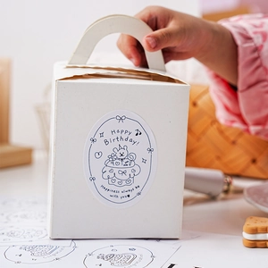 White gift box with handles featuring a cute cartoon bear Happy Birthday sticker label