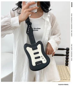 Chic guitar shaped crossbody bag in black and white with star details and chain strap