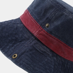 Detail of vintage washed wide brim hat with corduroy texture and red accent band