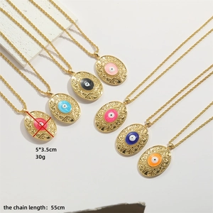 Vintage gold oval evil eye pendant necklace with colorful enamel and twist chain