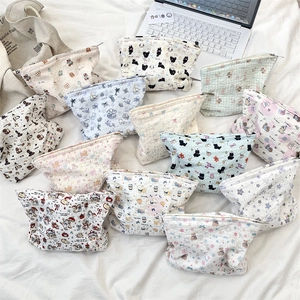 Detailed top view of 12 cute embossed cartoon cosmetic bags in various patterns