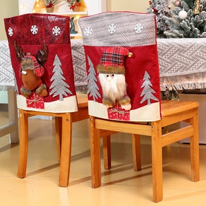 Detail of Santa and Reindeer chair covers with 3D antlers and embroidery for Christmas