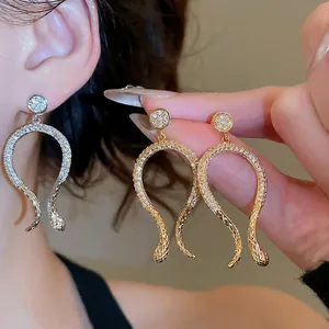Luxury 14k gold plated snake drop earrings with pave set sparkling cubic zirconia crystals