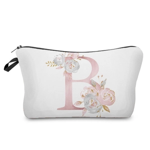 Close-up detail of white cosmetic bag with elegant pink floral letter B pattern