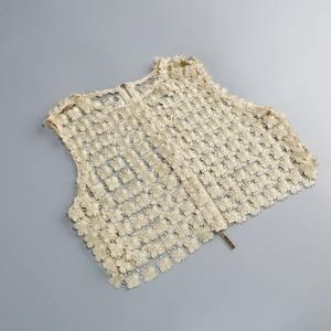 Detail of champagne lace crop top featuring 3D floral textures and back zipper