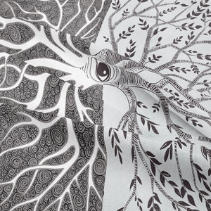 Close-up of bohemian mandala tapestry featuring detailed spiral patterns and leaf prints