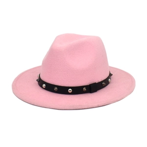 Close-up of pink wool fedora hat featuring a black leather band with silver metal studs