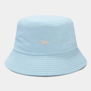 Detailed close-up of cartoon fox embroidery on a light blue cotton bucket hat