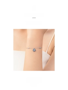 Detail of s925 silver Evil Eye bracelet with blue crystal and white pavé zircons