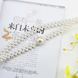Elastic pearl waist belt with luxury rhinestone buckle for dress on fashion magazine