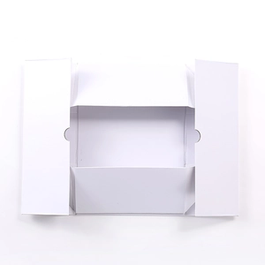 Flat lay of an unassembled white folding gift box showing its precise cutout structure
