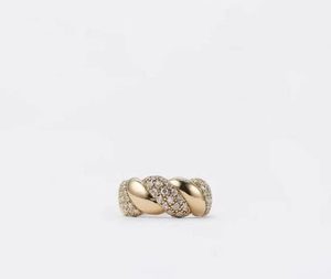 Close-up of a gold-plated twisted ring featuring sparkling zircon pavé micro-inlay