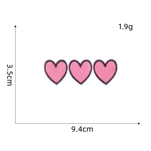 Detailed view of pink triple heart embroidered patch with dimensions 9.4cm by 3.5cm