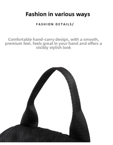 Detalle de una mochila acolchada negra con asa superior de tela tejida texturizada
