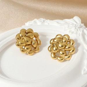 Golden hollow rotating teardrop flower earrings made of durable stainless steel