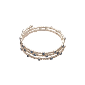 Three-layer spiral zircon bracelet in silver with deep blue rhinestones on white background