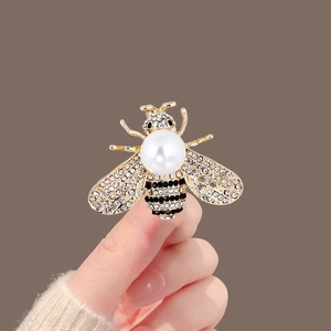 Elegant gold-tone bee brooch with white pearls and sparkling rhinestones for coats